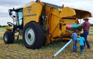 A new self-propelled baler is hopefully the key to keeping business booming for Texas Farm Bureau members Justin and Lindsay Hannsz.