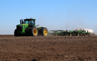 john deere tractor pulling a plow and fertilizer tank fertilizer grants
